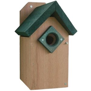 Western Red Cedar Bluebird House with green roof and predator guard mounted on a tree for nesting bluebirds