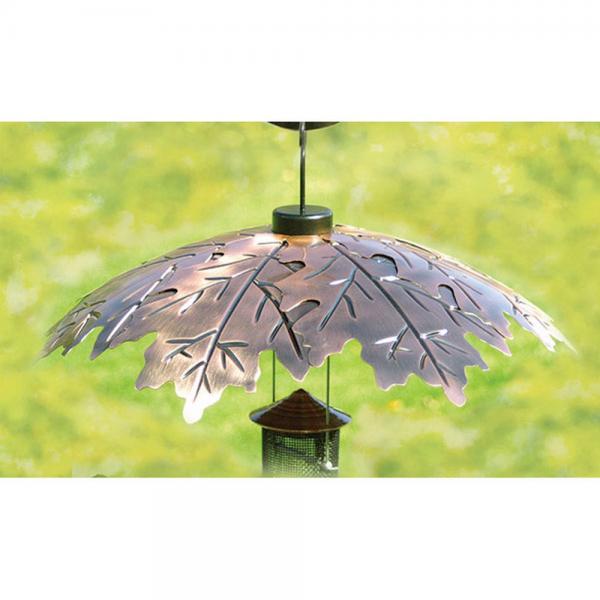 Brushed copper bird feeder weather shield protecting a hanging bird feeder from rain