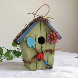 Rustic wooden hanging birdhouse with colorful garden design
