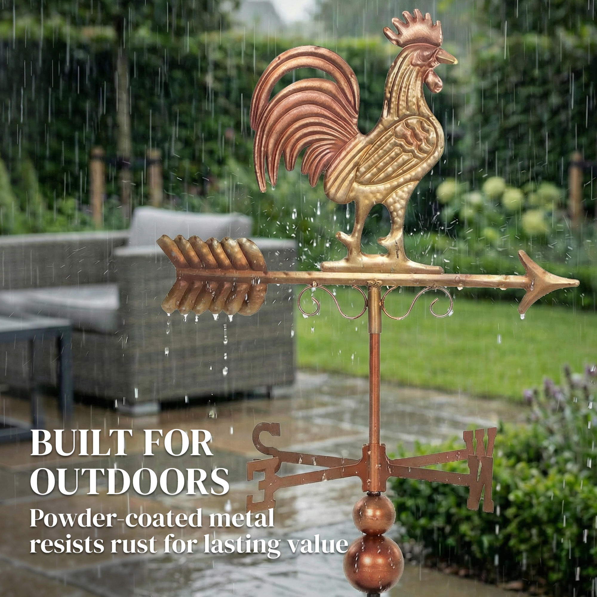 Rustic metal rooster weathervane with red and brown finish and directional arrow in a garden patio - view 3