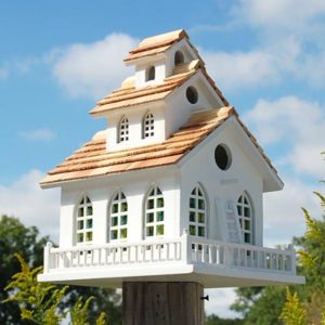 Home Bazaar Chapel Bell decorative wooden birdhouse in white with tiered shingle roof, bell tower and railing on a post