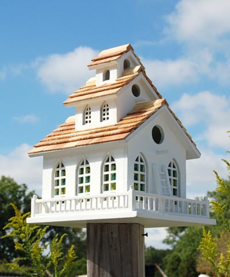 Home Bazaar Chapel Bell decorative wooden birdhouse in white with tiered shingle roof, bell tower and railing on a post